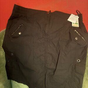 Calvin Klein black short skirt size large.  New with tags